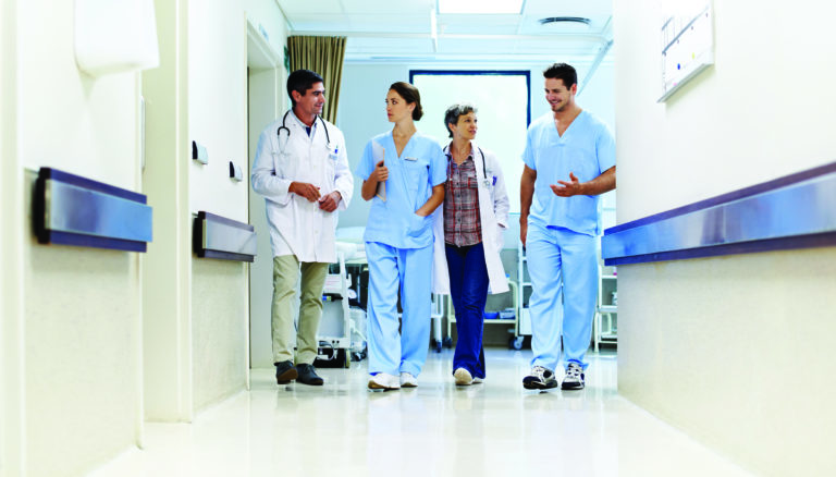 Healthcare Workers in hospital hallway